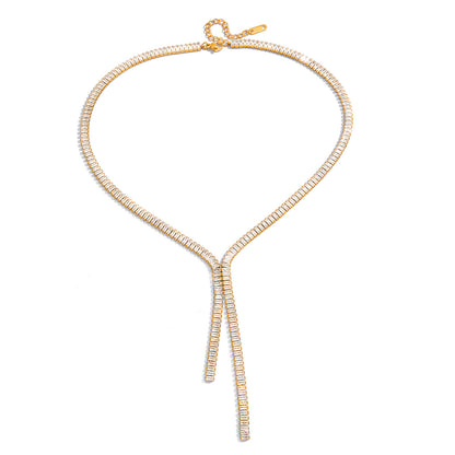 Gold necklace with a bow design on a white background