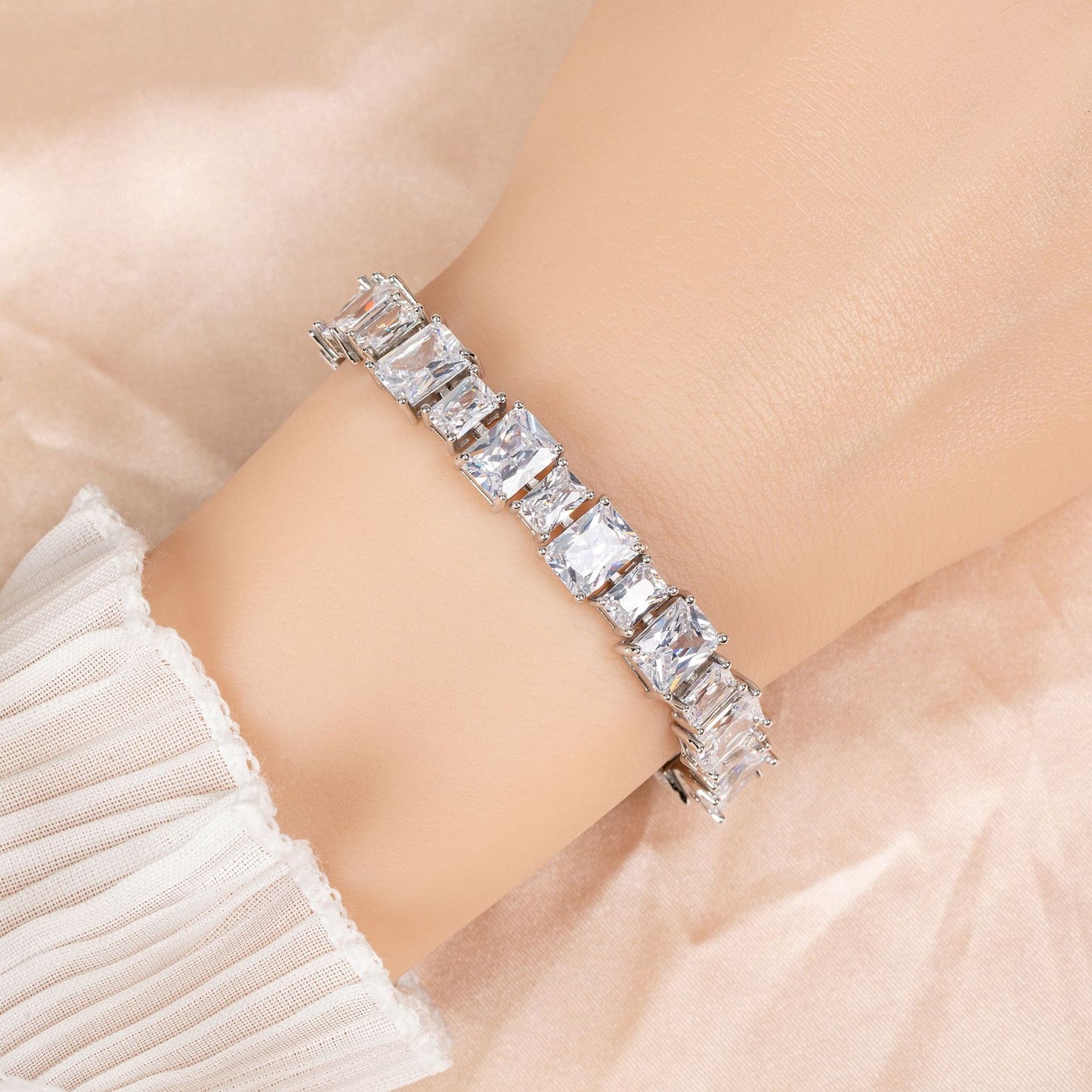 Diamond bracelet on a wrist with a soft background