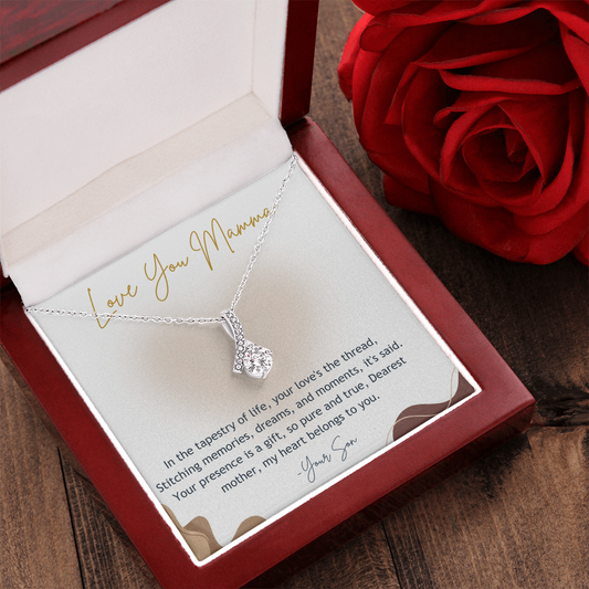 Alluring Beauty necklace with gift card in luxury box with a red rose in a side with a wooden background 