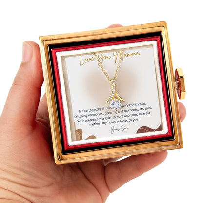 Alluring beauty necklace gold version with rotating rose gift box holding by a hand in white background