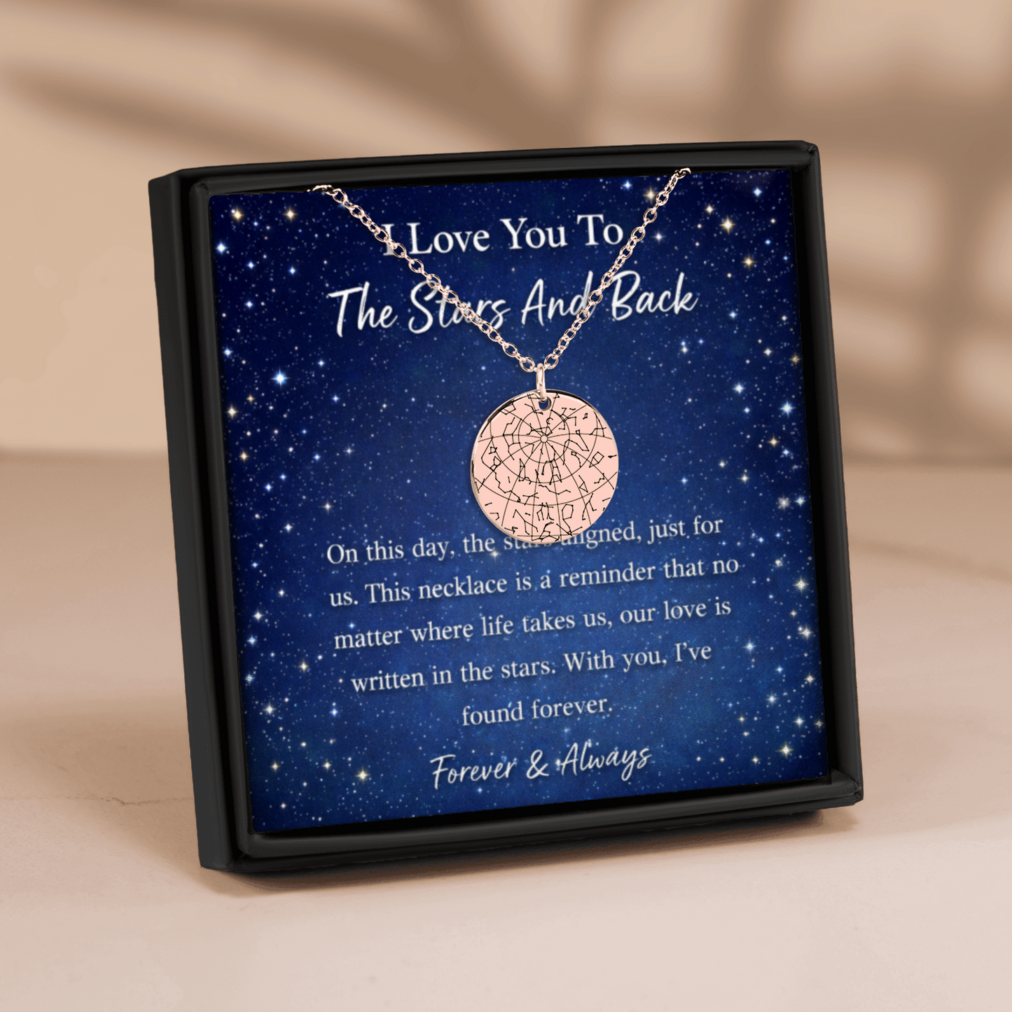 Necklace in a box with a starry night design and sentimental text.