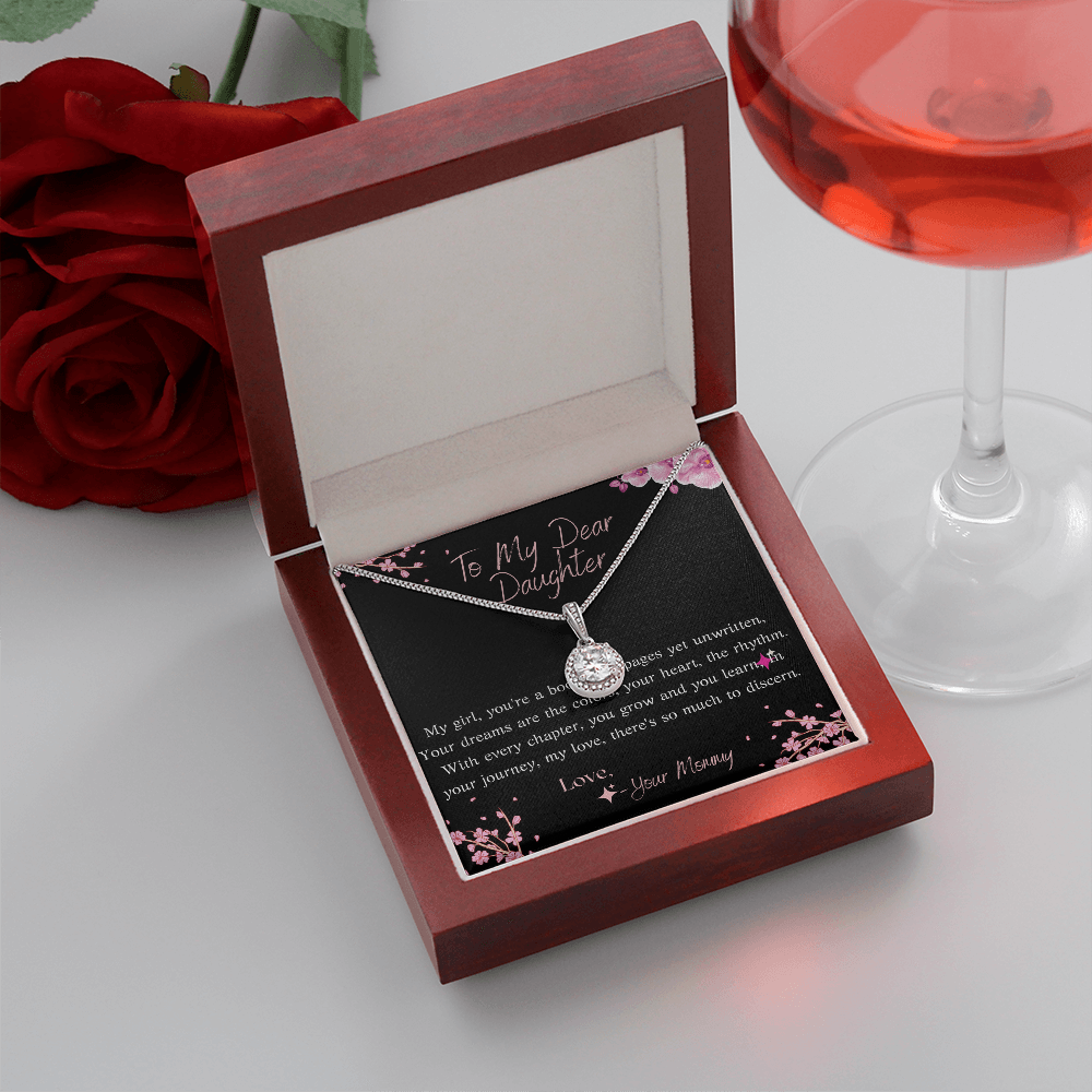eternal hope necklace in luxury box with gift card in white background with a red rose and wine glass