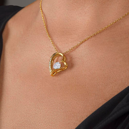 A women has Worn the Gold Forever Love Necklace