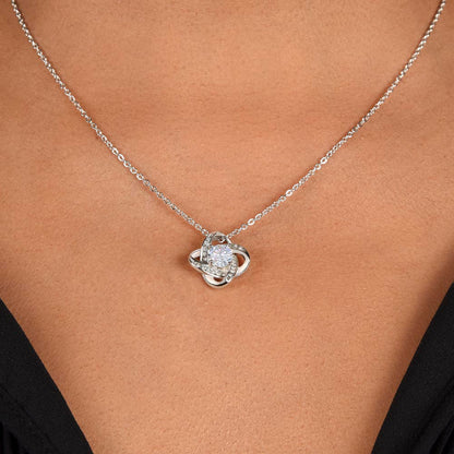 a women has worn love knot necklace 