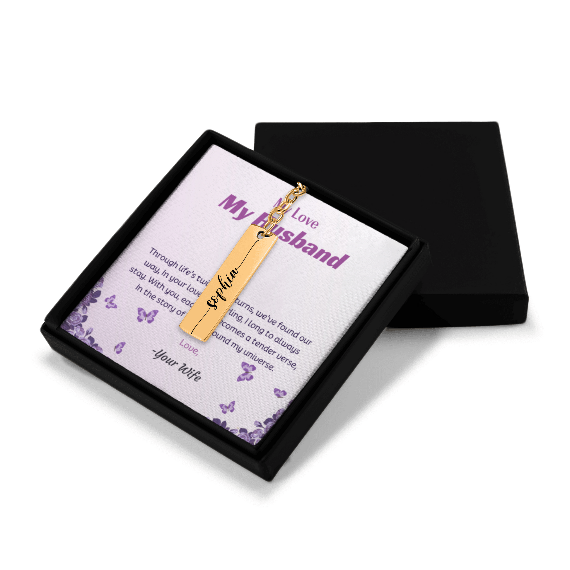 Gold necklace with a bar pendant on a card in a black box
