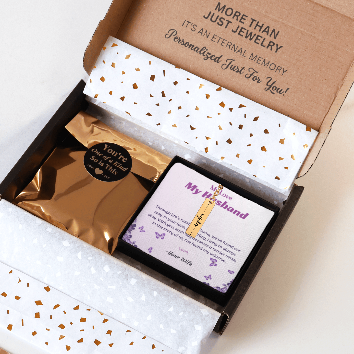 Jewelry box with a personalized message card and gold packaging