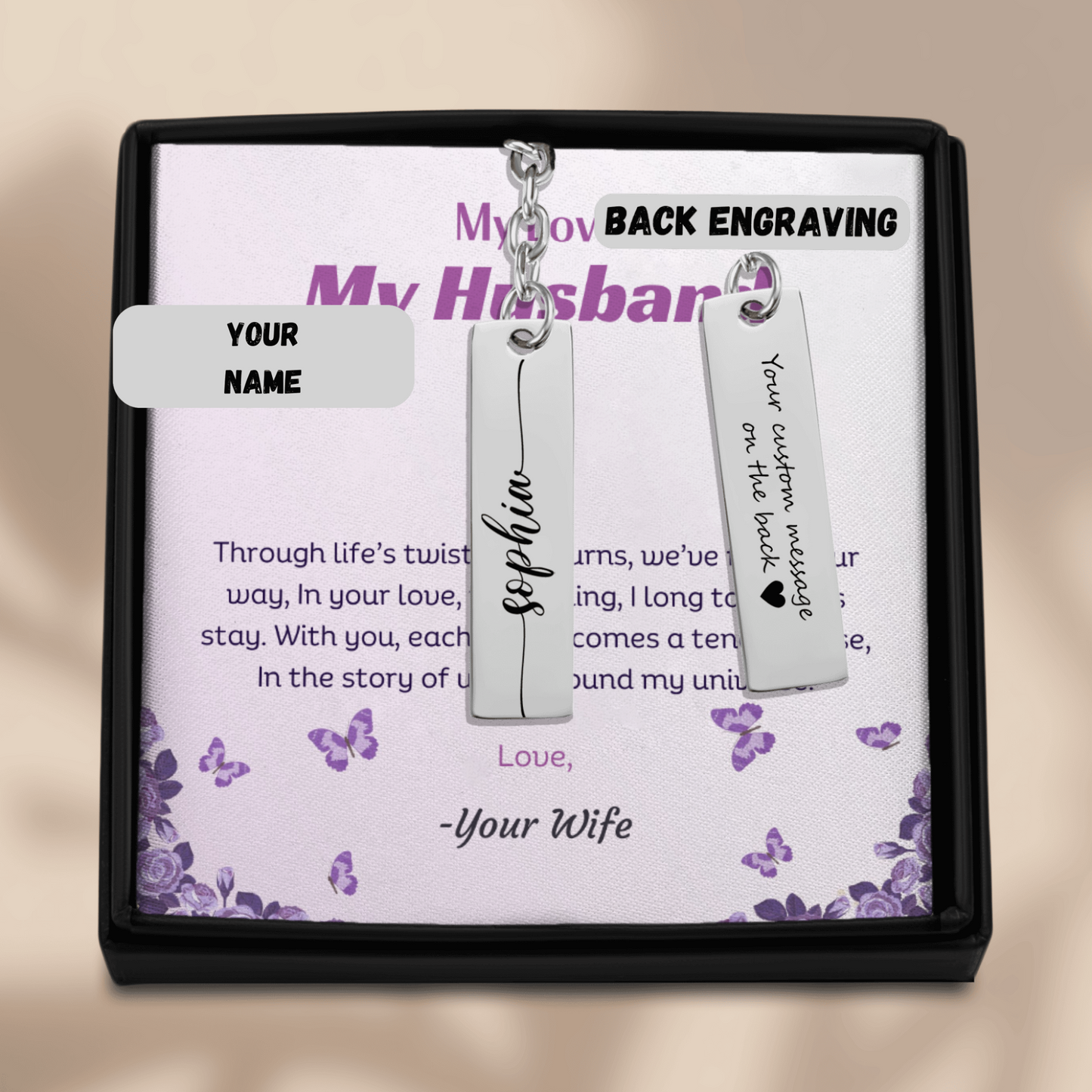 Personalized silver earrings with customizable back engraving in a decorative box.