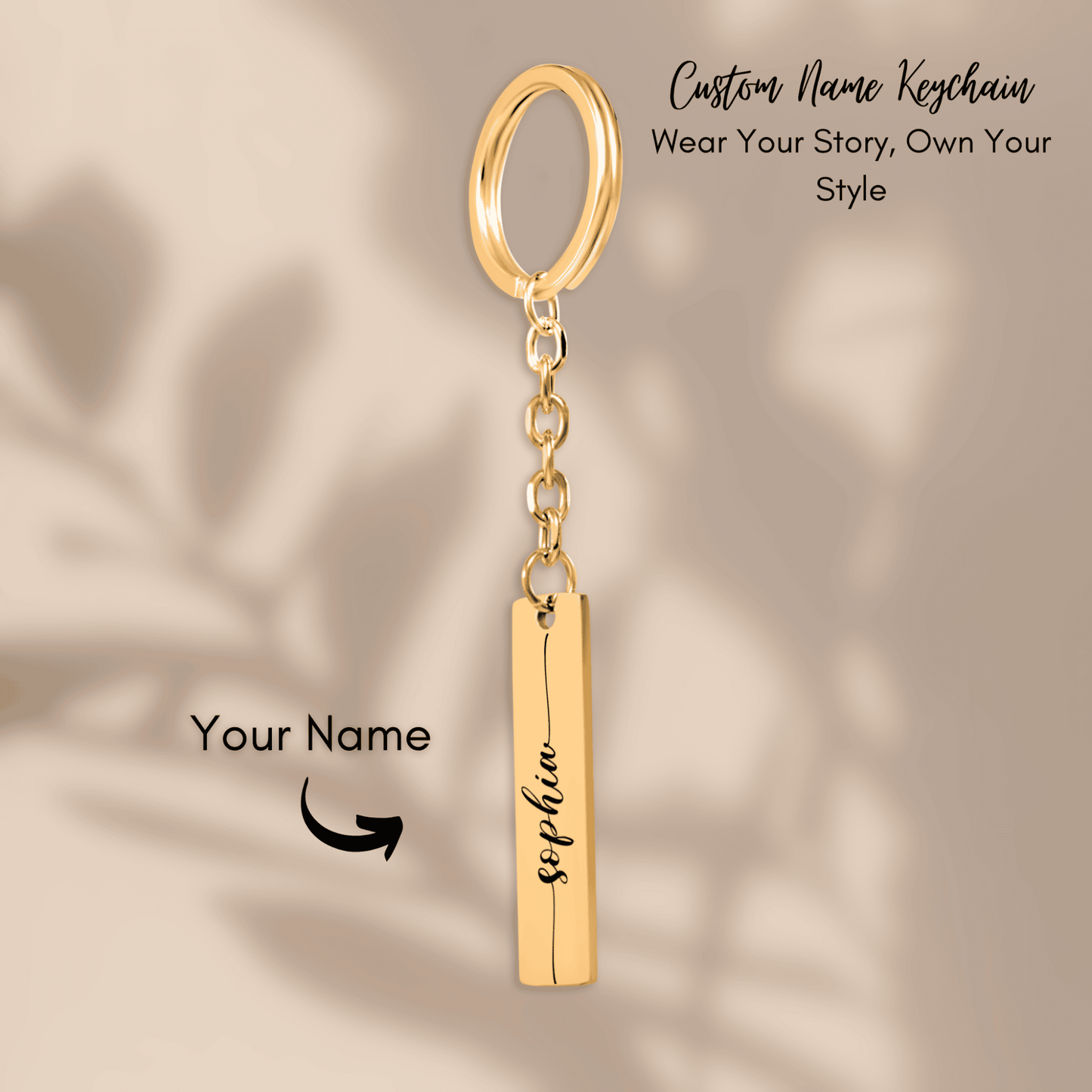 Gold keychain with a bar pendant on a beige background