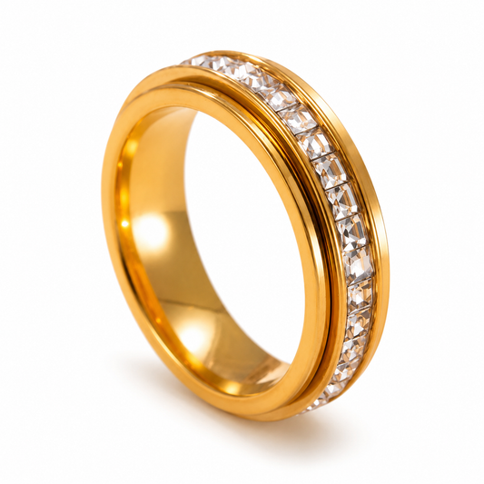 Gold ring with diamond accents on a white background