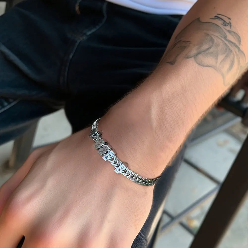 Silver bracelet on a wrist with a blurred background