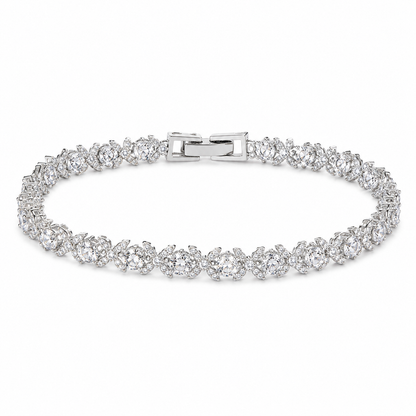 Silver bracelet with clear stones on a white background
