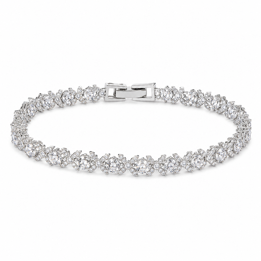 Silver bracelet with clear stones on a white background