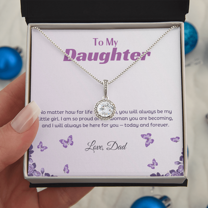 A beautiful hand holding the classic box with the eternal hope necklace in it in a white blue background 
