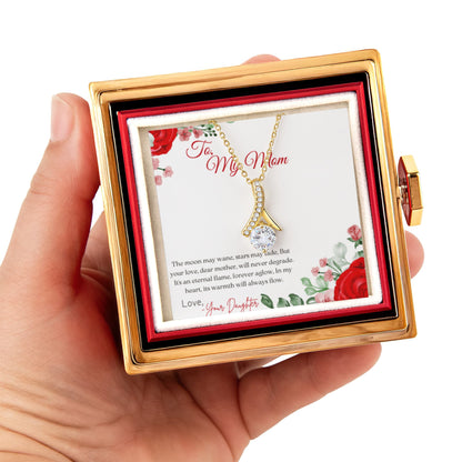 Alluring Beauty Gold neckalce in a rotating rose jewelry box  with a card inside, held by a hand.