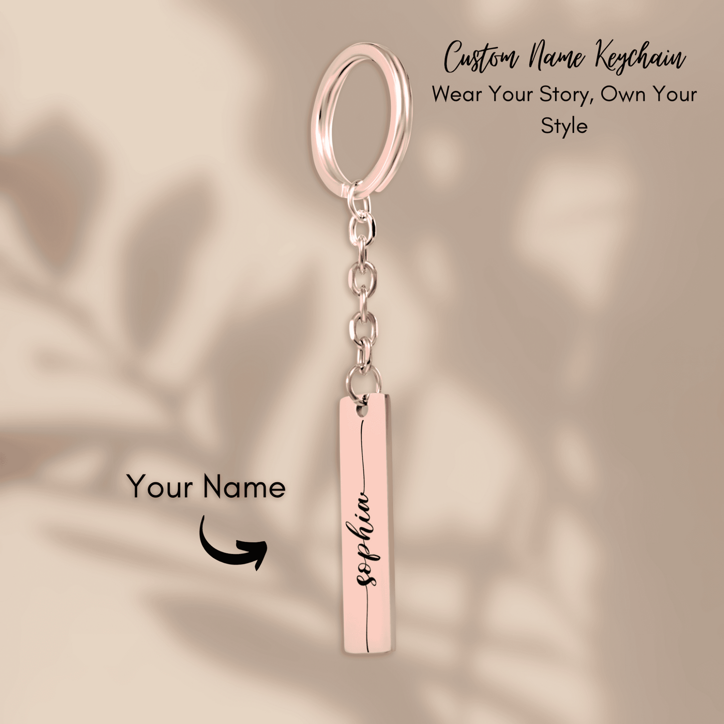 Custom name keychain with a rose gold bar and ring on a beige background