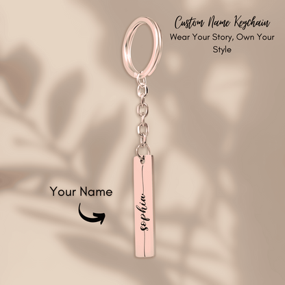Custom name keychain with a rose gold bar and ring on a beige background