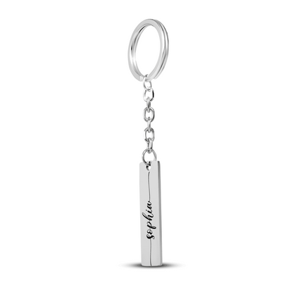 Silver keychain with a vertical bar pendant on a white background