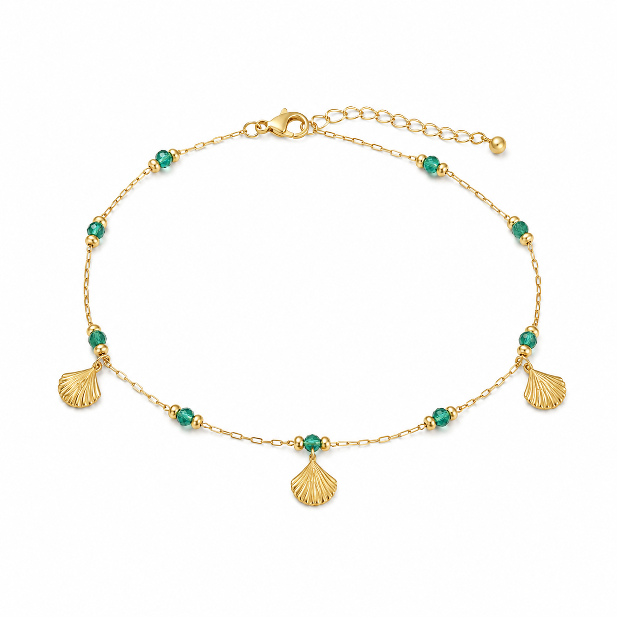 Gold bracelet with green beads and shell charms on a white background